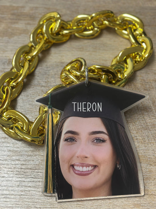 Custom acrylic face cutout attached to a hype chain worn at a graduation party