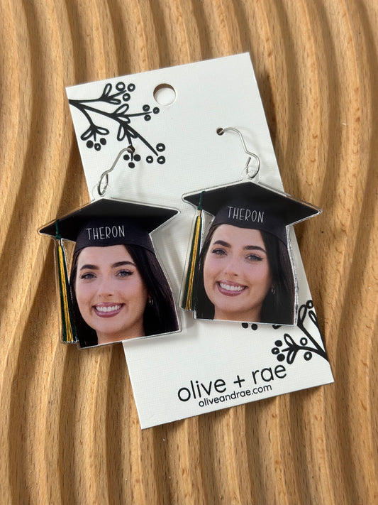 Personalized face earrings worn at a party
